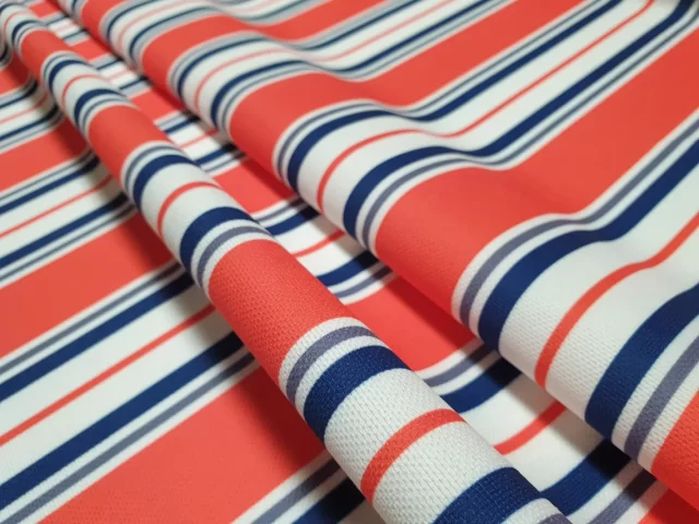 Living Coral Navy Blue Striped Fabric
